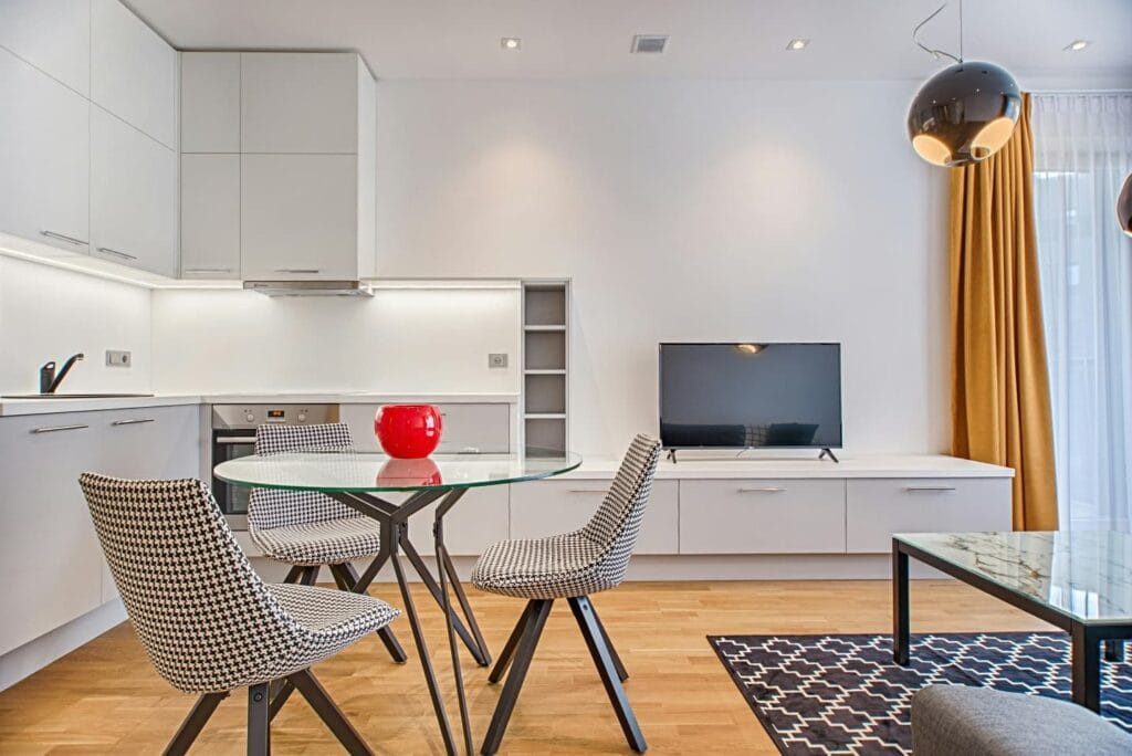 dining table and TV set in a room