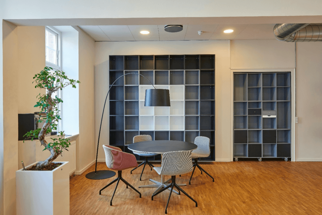 office space with wooden flooring and round table