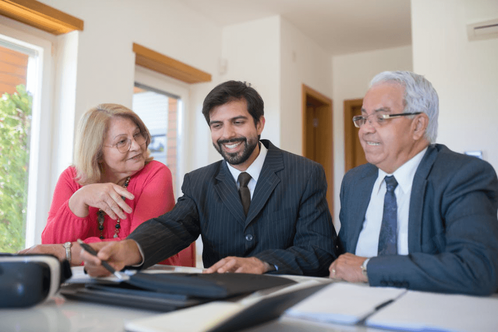 Three people sitting together working on consultation