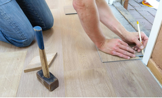 person installing flooring