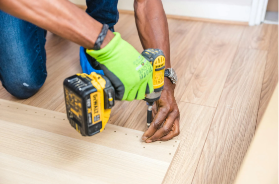 worker installing flooring 