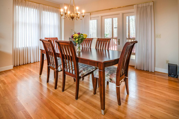 Contemporary living room with expertly installed hardwood flooring.