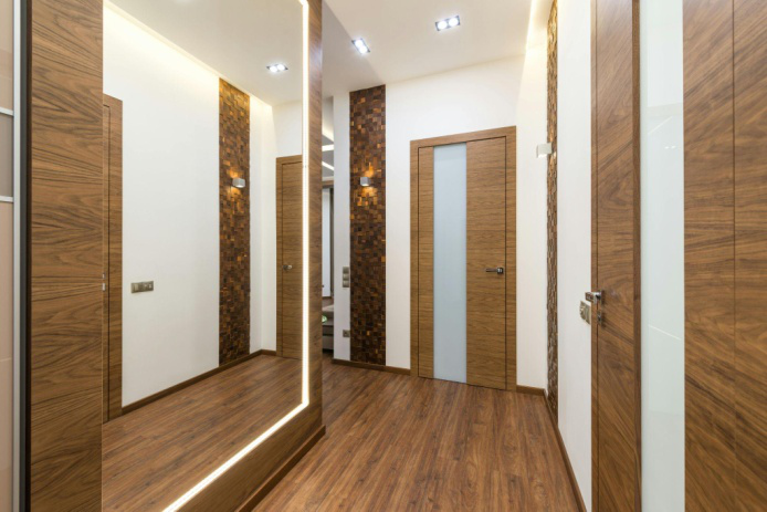 Expertly installed durable vinyl plank flooring in an office hallway.